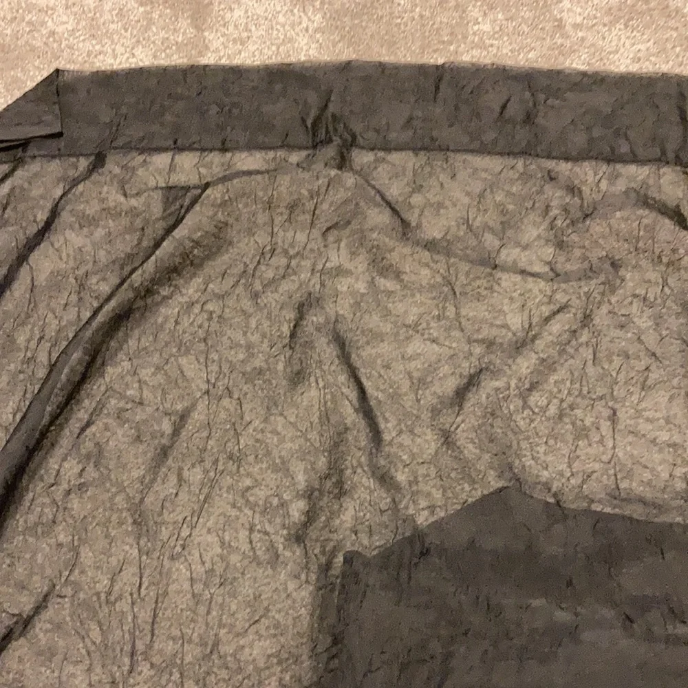 Single panel black sheer curtain